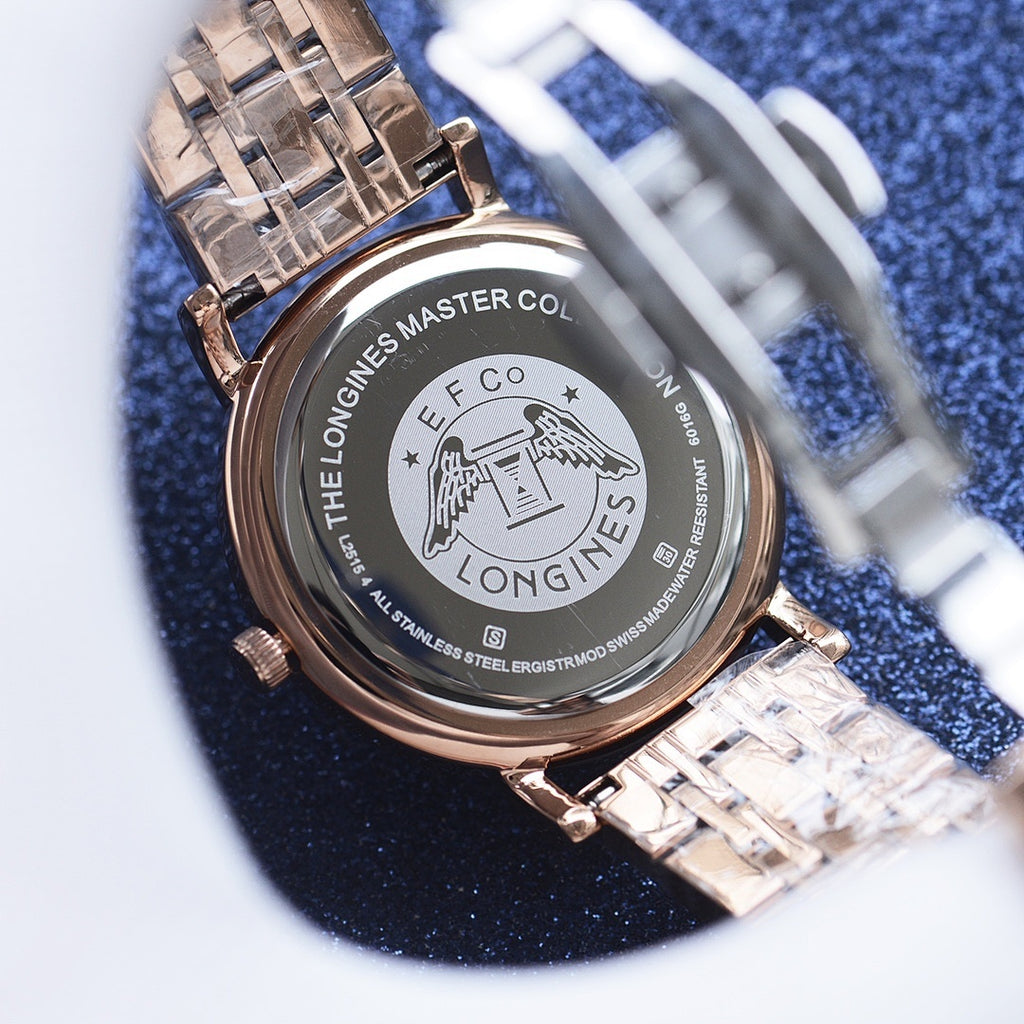 Longines watch caseback with engraved master collection text and stainless steel bracelet