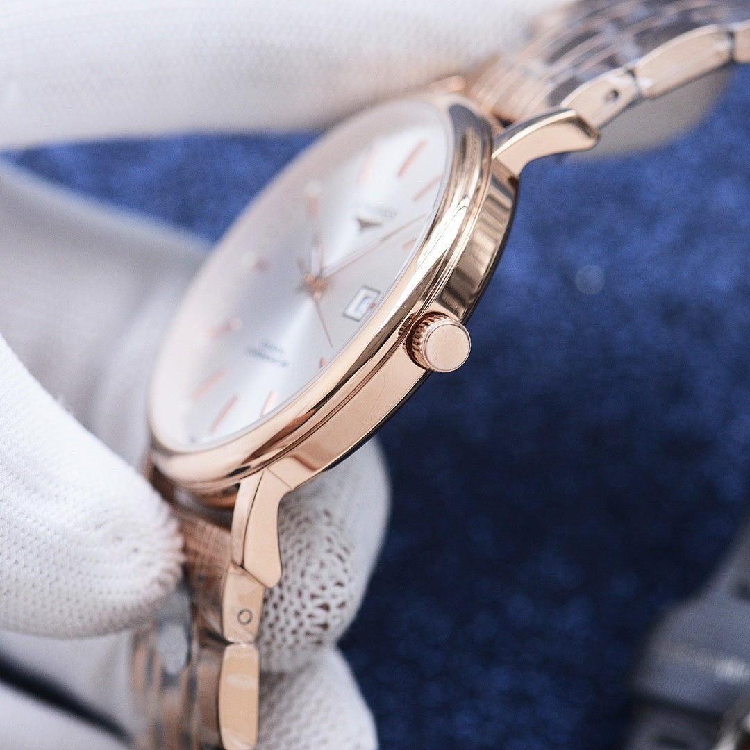 Longines rose gold watch case with crown and light dial on a metal bracelet
