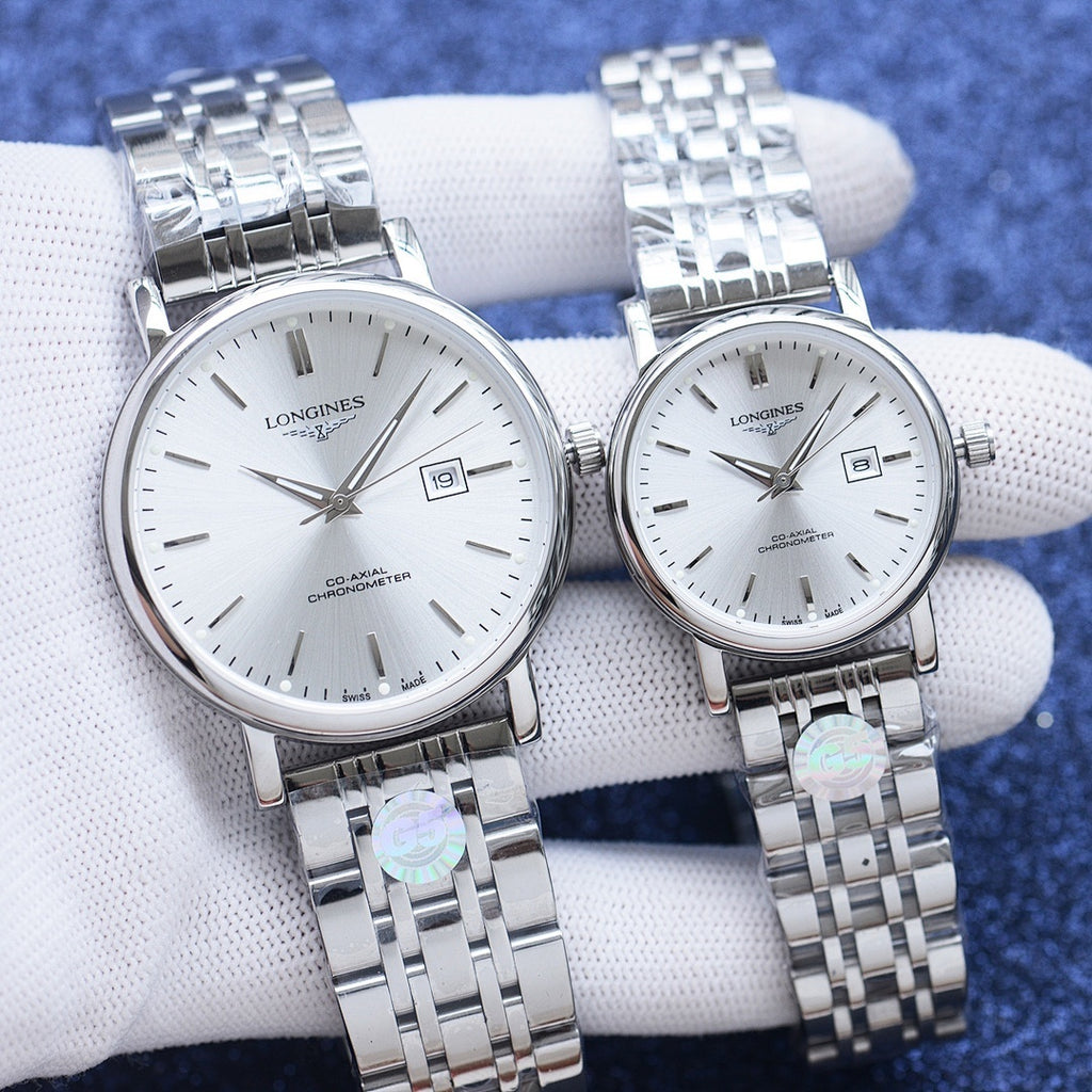 Longines pair of wristwatches with white dials and silver metal link bracelets