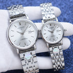 Longines pair of wristwatches with white dials and silver metal link bracelets