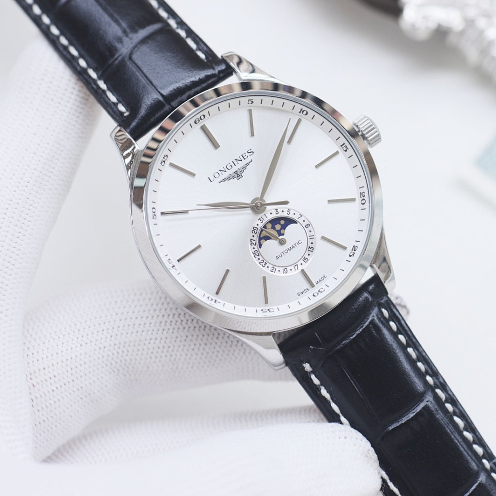Longines watch with white dial, silver case, and black leather strap with stitching