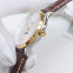 Longines watch with white dial, gold-tone bezel, and brown leather strap