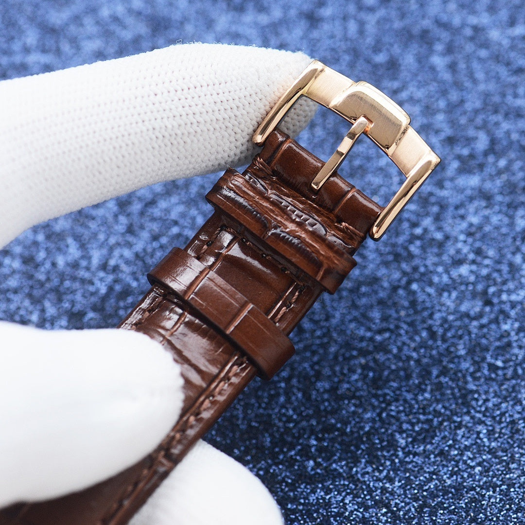Longines watch with brown leather strap and gold-tone buckle