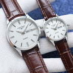 Longines quartz watch pair with white dials and brown leather straps
