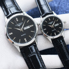 Longines quartz watch pair with black dials and glossy black leather straps