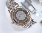 Rose-gold watch case back with engraved master collection medallion