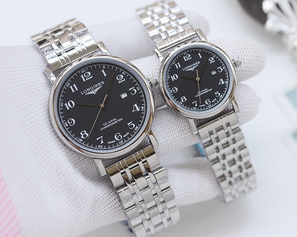 Pair of stainless steel watches with black dials and metal bracelet straps