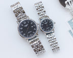 Pair of stainless steel watches with black dials and silver bracelet straps