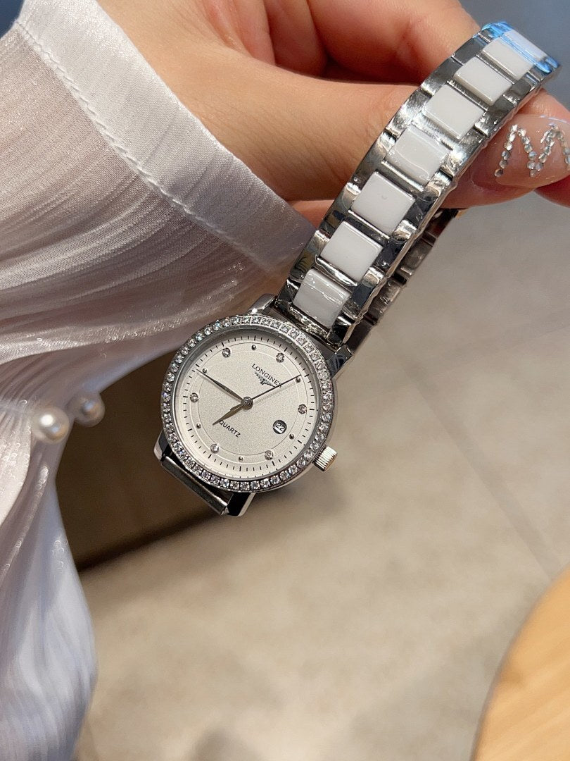 Longines watch with silver-tone link bracelet and round white dial with hour markers