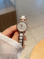 Longines watch with silver-tone bracelet and round white dial with dark hands