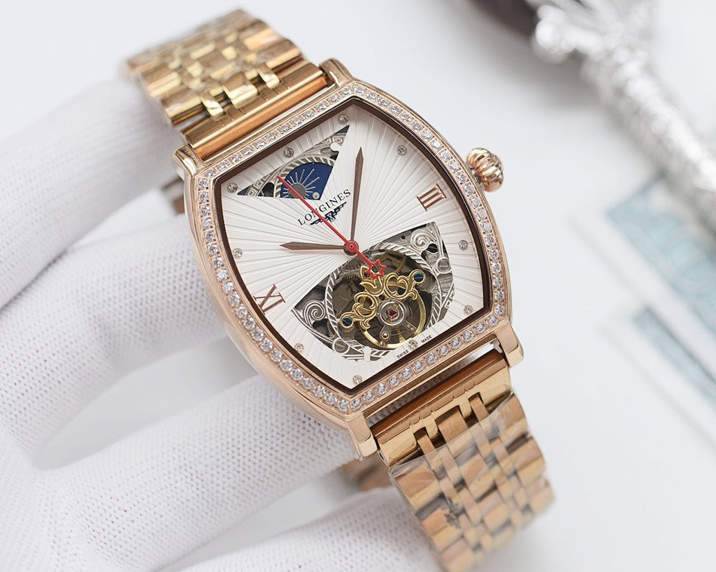 Gold-tone rectangular wristwatch with diamond bezel, light skeleton dial, red second hand.