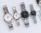 Set of four quartz wristwatches with mixed metal and leather straps, round cases