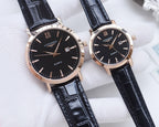 Quartz wristwatch with dark dial, rose-gold case, black leather strap