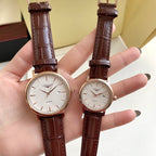 Longines wristwatch with brown leather strap, white dial, two watches side by side