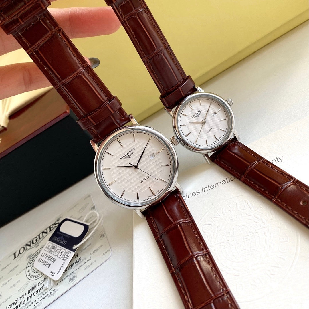 Longines wristwatch pair with brown leather straps and silver cases, white dials