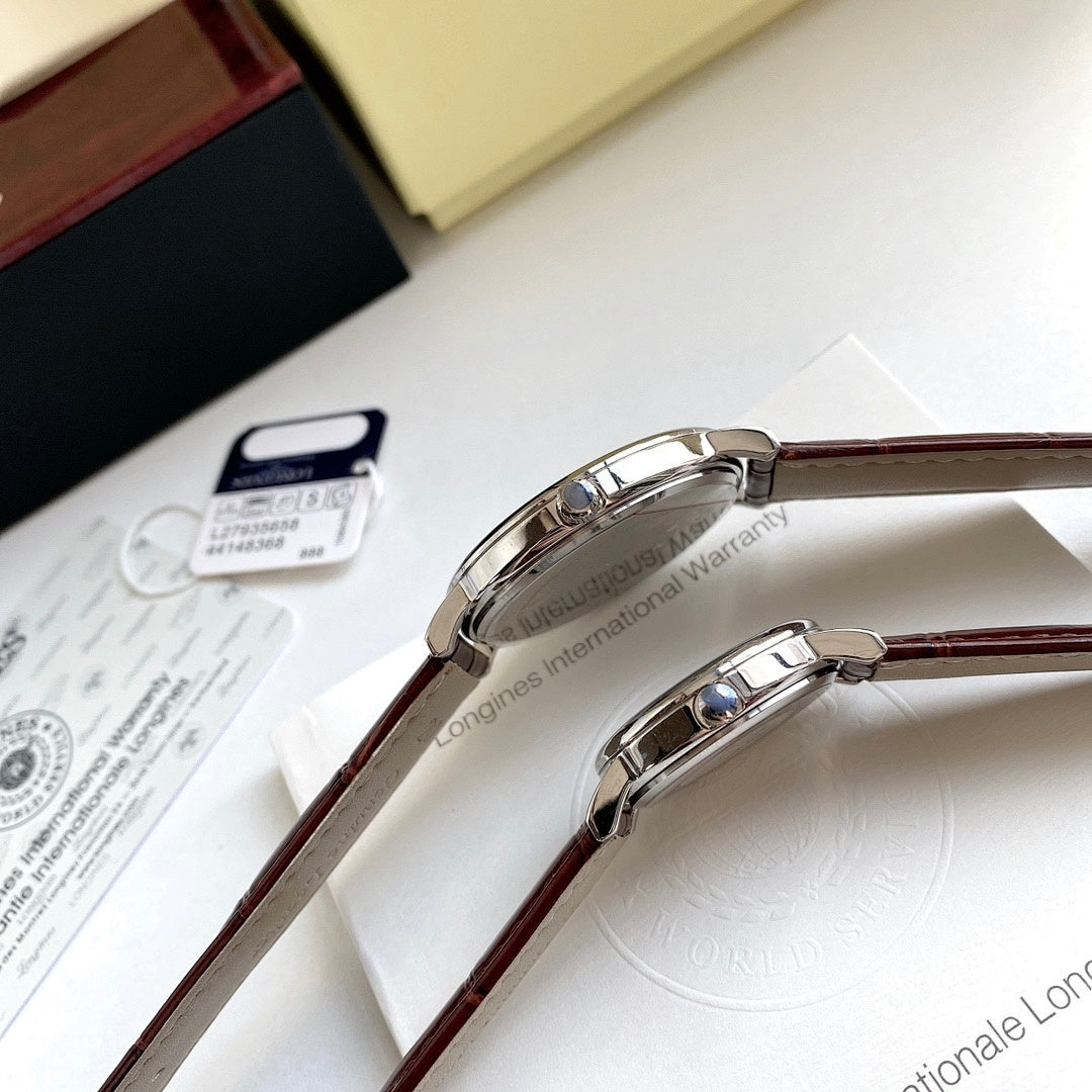 Longines wristwatch case close-up with brown leather strap and metal buckle