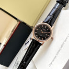 Longines wristwatch with black leather strap and rose-toned case, black dial