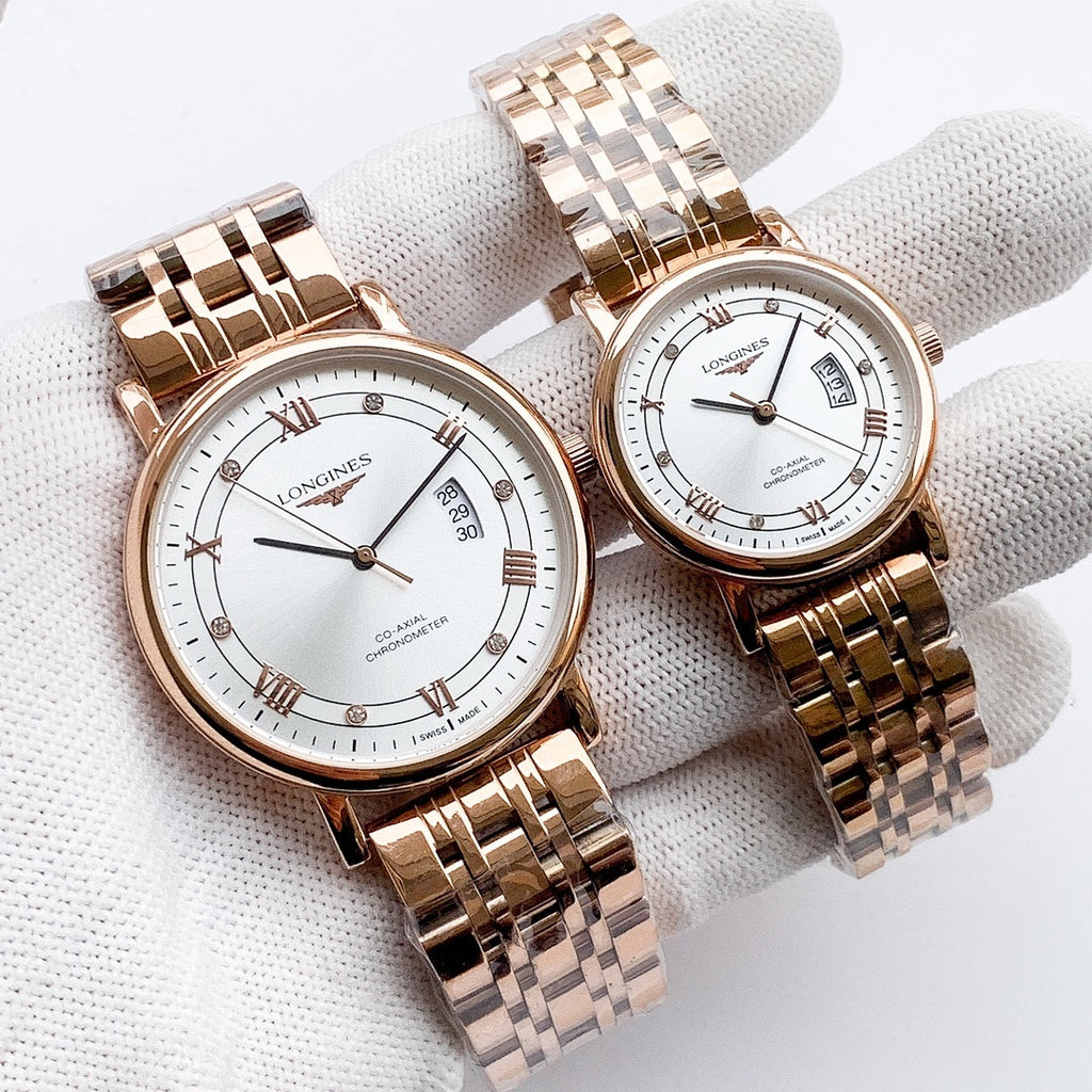 Longines watch with rose-gold metal bracelet, white dial, Roman numerals and date window.