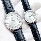 Longines watch with dark leather strap, white dial, Roman numerals and date window.