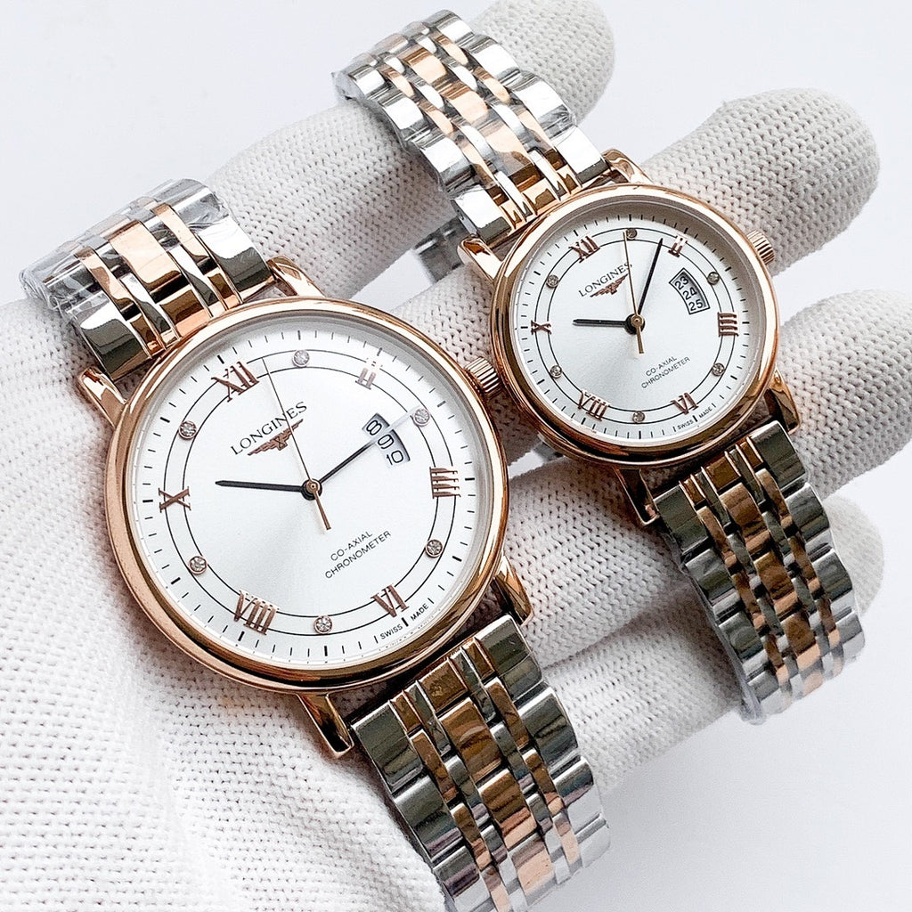 Longines watch with two-tone metal bracelet, white dial, Roman numerals and date window.