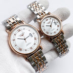 Longines watch with two-tone metal bracelet, white dial, Roman numerals and date window.