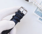 Longines leather watch strap with metal buckle and clasp, shown from the side