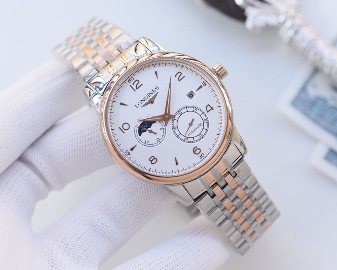 Longines wristwatch with silver mesh bracelet, white dial and rose-tone accents