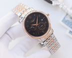 Longines wristwatch with dark dial and silver mesh bracelet, rose-tone hands