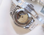 Longines two-tone automatic watch caseback with exposed movement