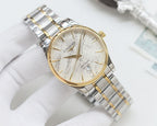 Gold-bezel Longines wristwatch with white dial and two-tone steel bracelet, round case