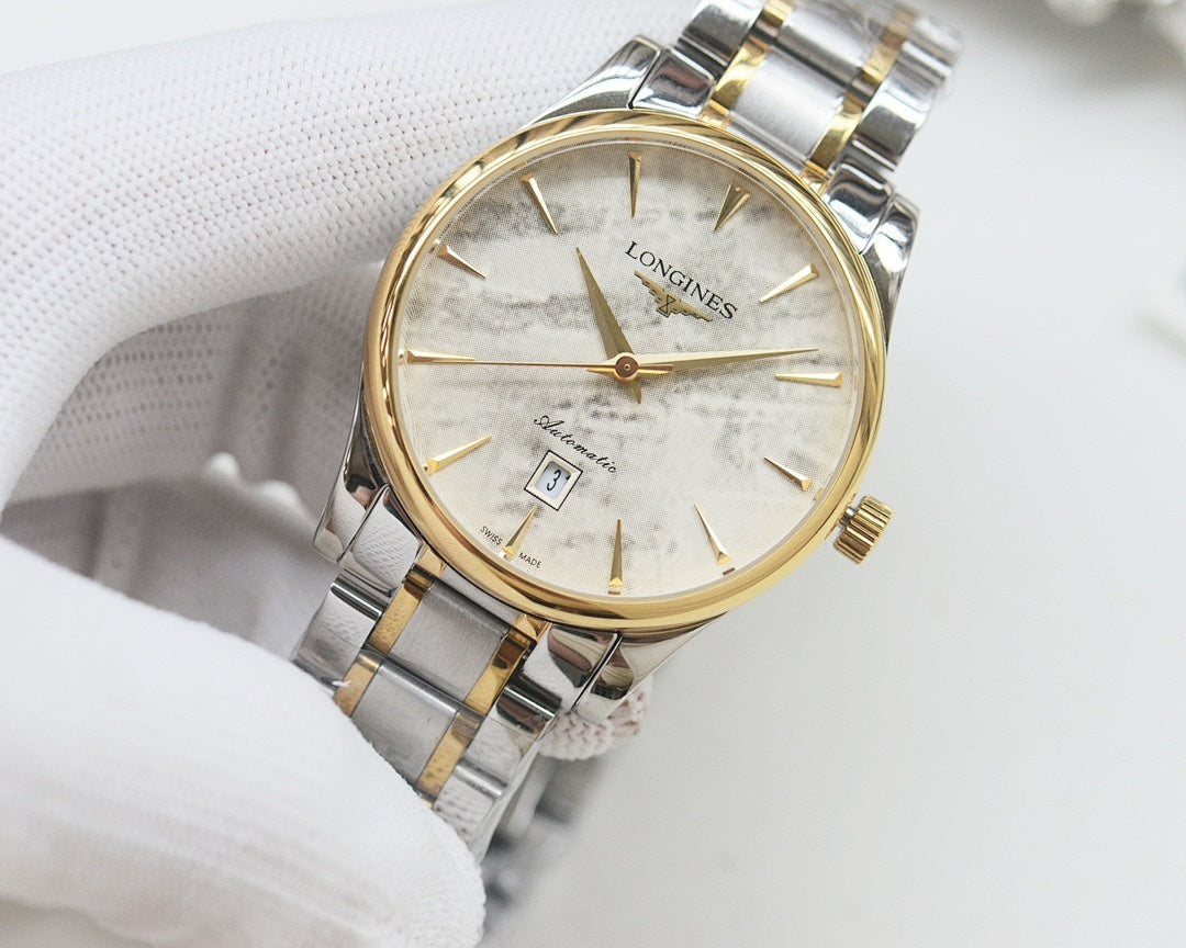 Two-tone Longines wristwatch with gold bezel, light dial, and linked steel bracelet