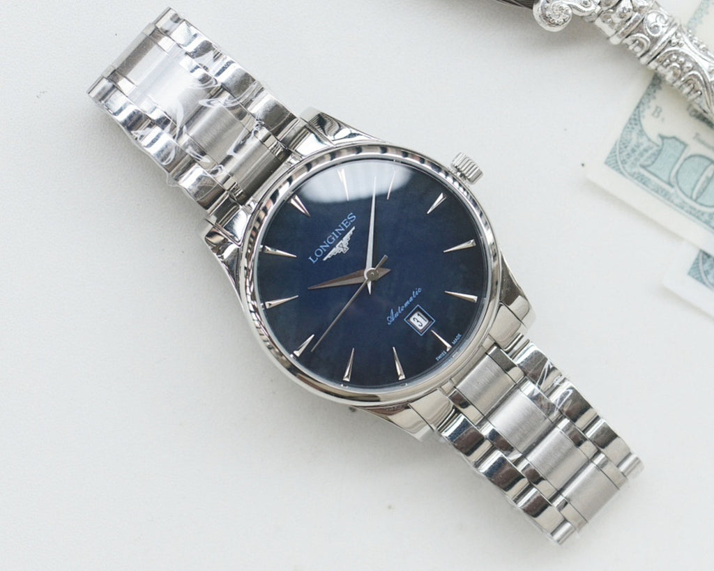Silver Longines wristwatch with dark blue dial and stainless steel bracelet