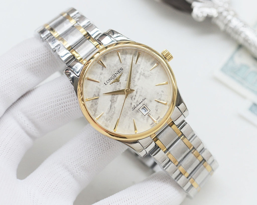 Two-tone Longines wristwatch with gold bezel, white dial, and linked steel bracelet