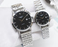 Longines stainless-steel wristwatch pair with black dials and metal link bracelets