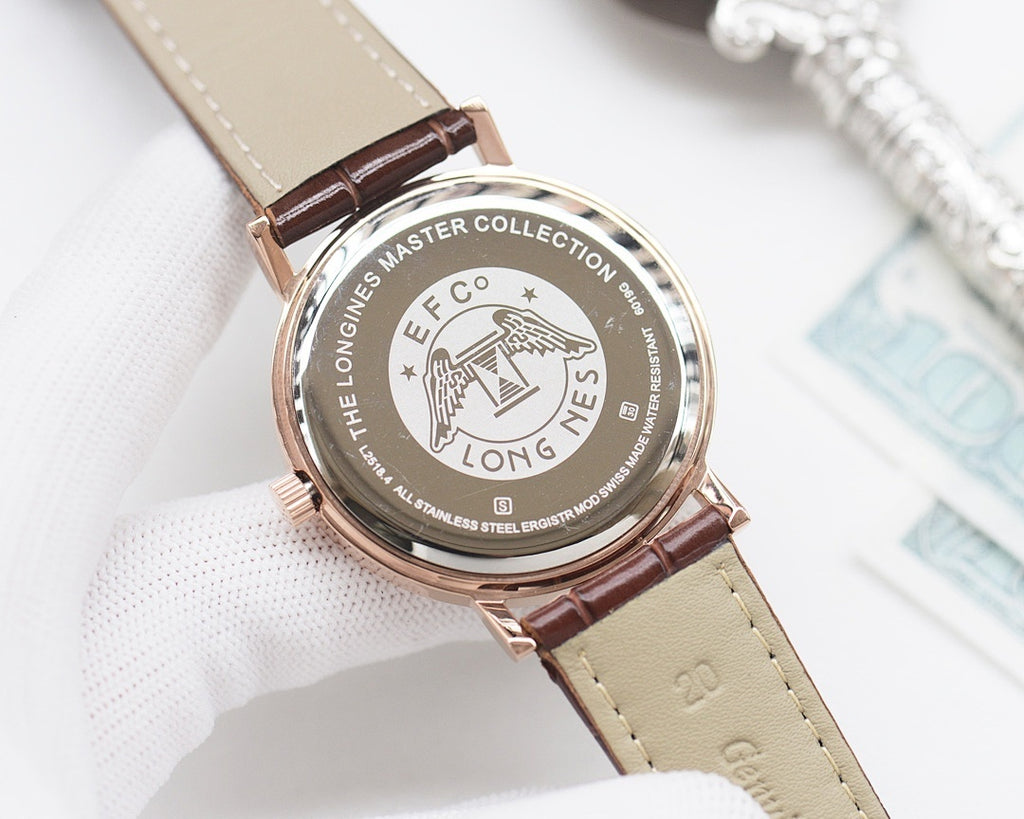 Longines watch with round engraved case, brown leather strap, and logo dial
