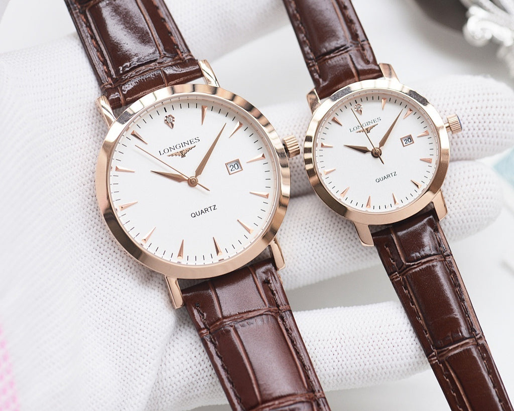 Rose-gold analog wristwatch pair with white dials and brown leather straps
