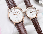 Rose-gold analog wristwatch pair with white dials and brown leather straps
