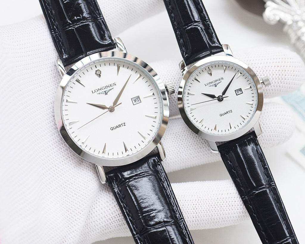 Silver analog wristwatch pair with white dials and black leather straps