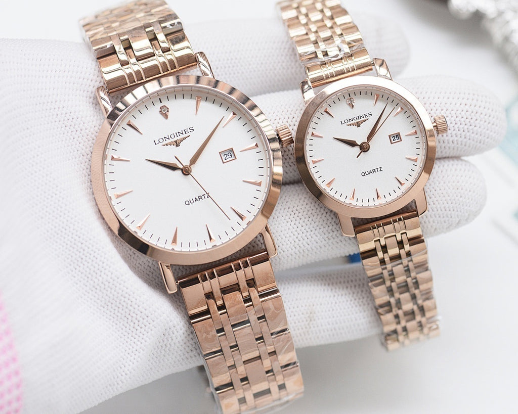 Rose-gold analog wristwatch pair with white dials and metal link bracelets
