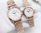 Rose-gold analog wristwatch pair with white dials and metal link bracelets