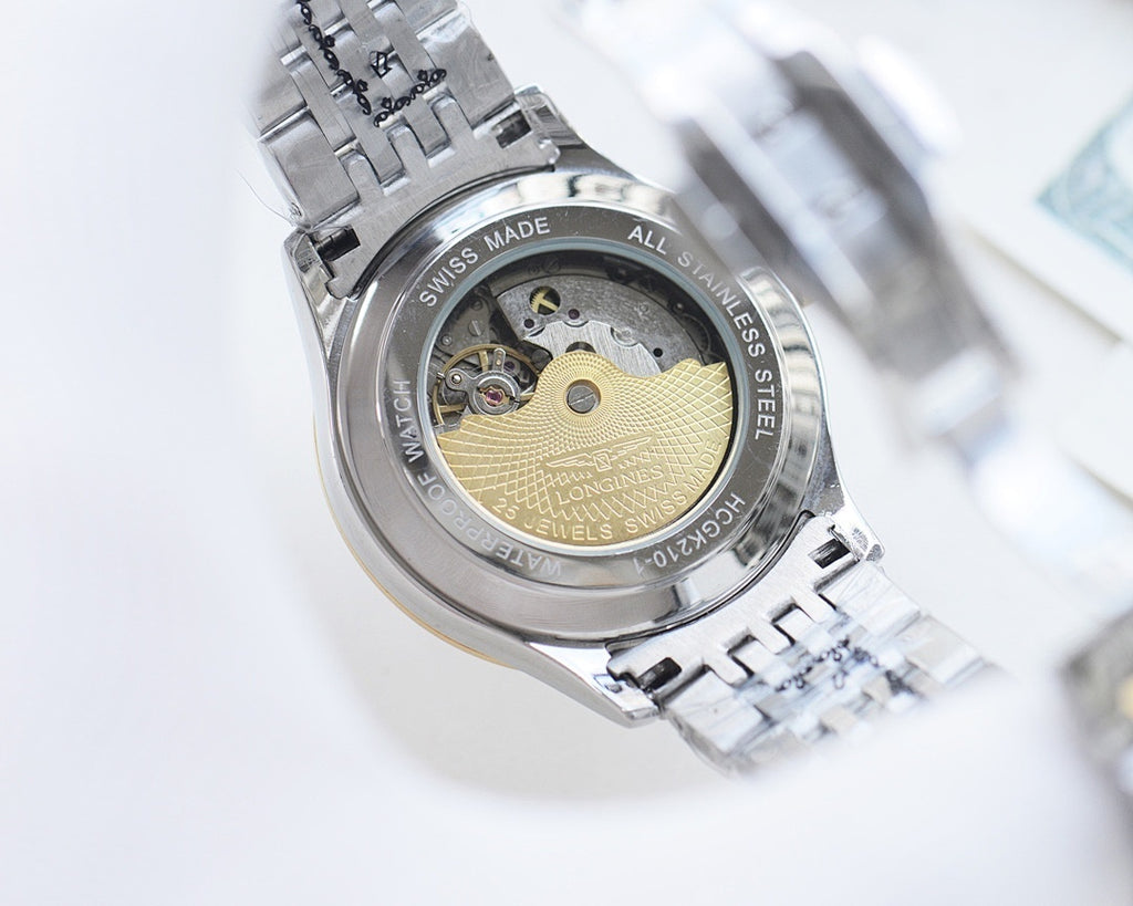 Longines automatic wristwatch case back with visible movement on steel bracelet