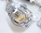 Longines automatic wristwatch caseback with exposed movement and gold rotor