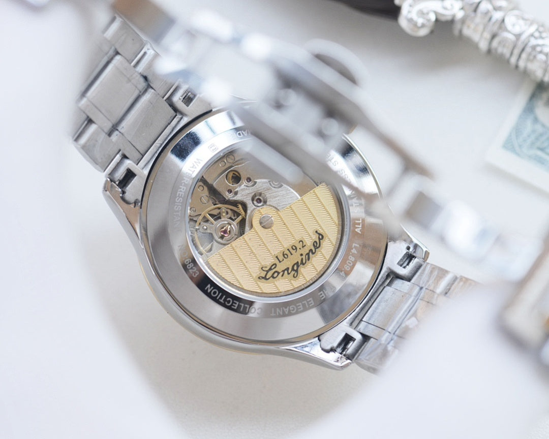 Longines automatic wristwatch caseback with exposed movement and gold rotor