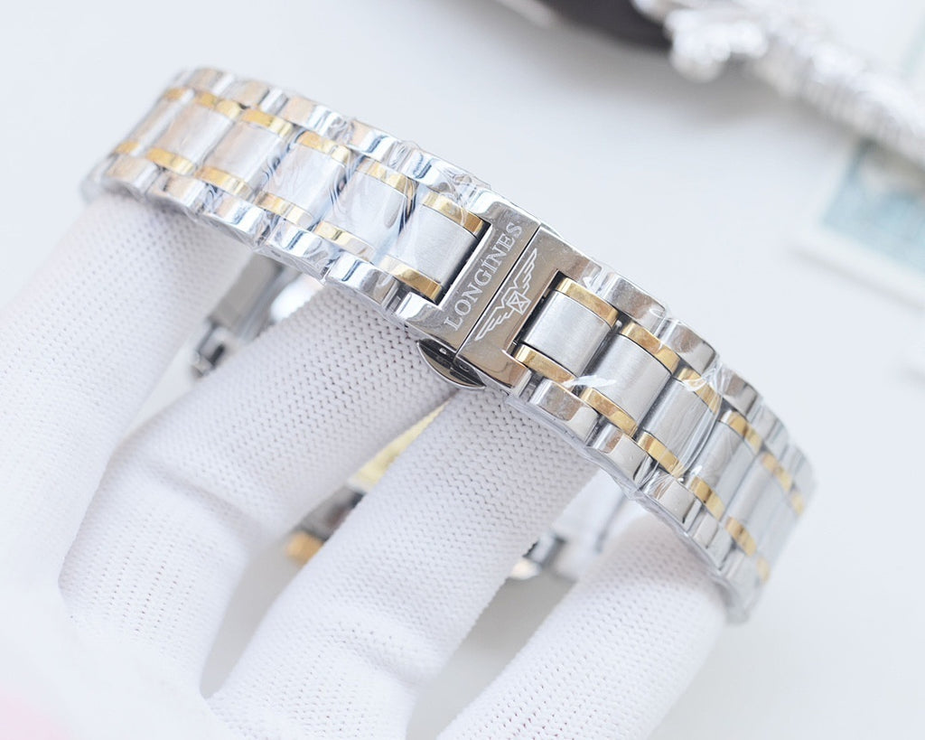 Longines metal bracelet watch with logo on clasp and gold center links