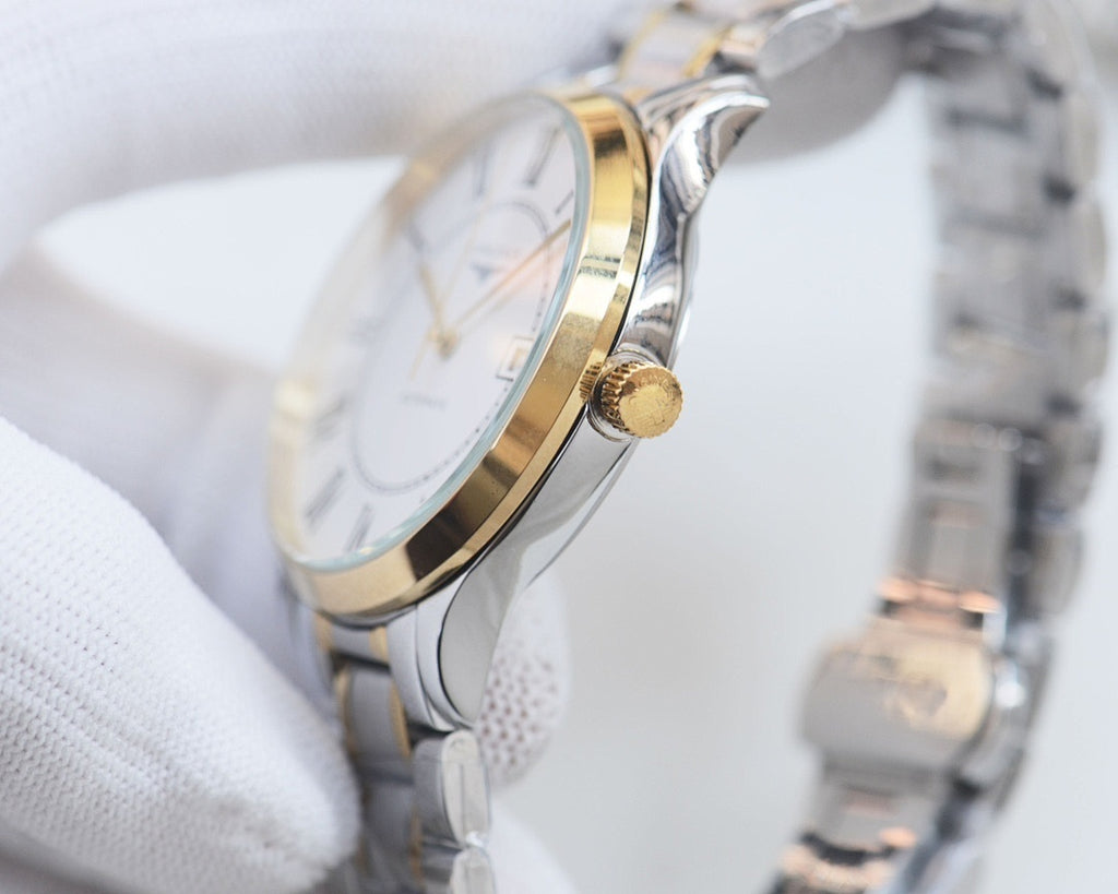 Longines gold-accent wristwatch with crown on round case and metal link bracelet