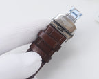 Longines wristwatch with brown leather strap and silver case, side view