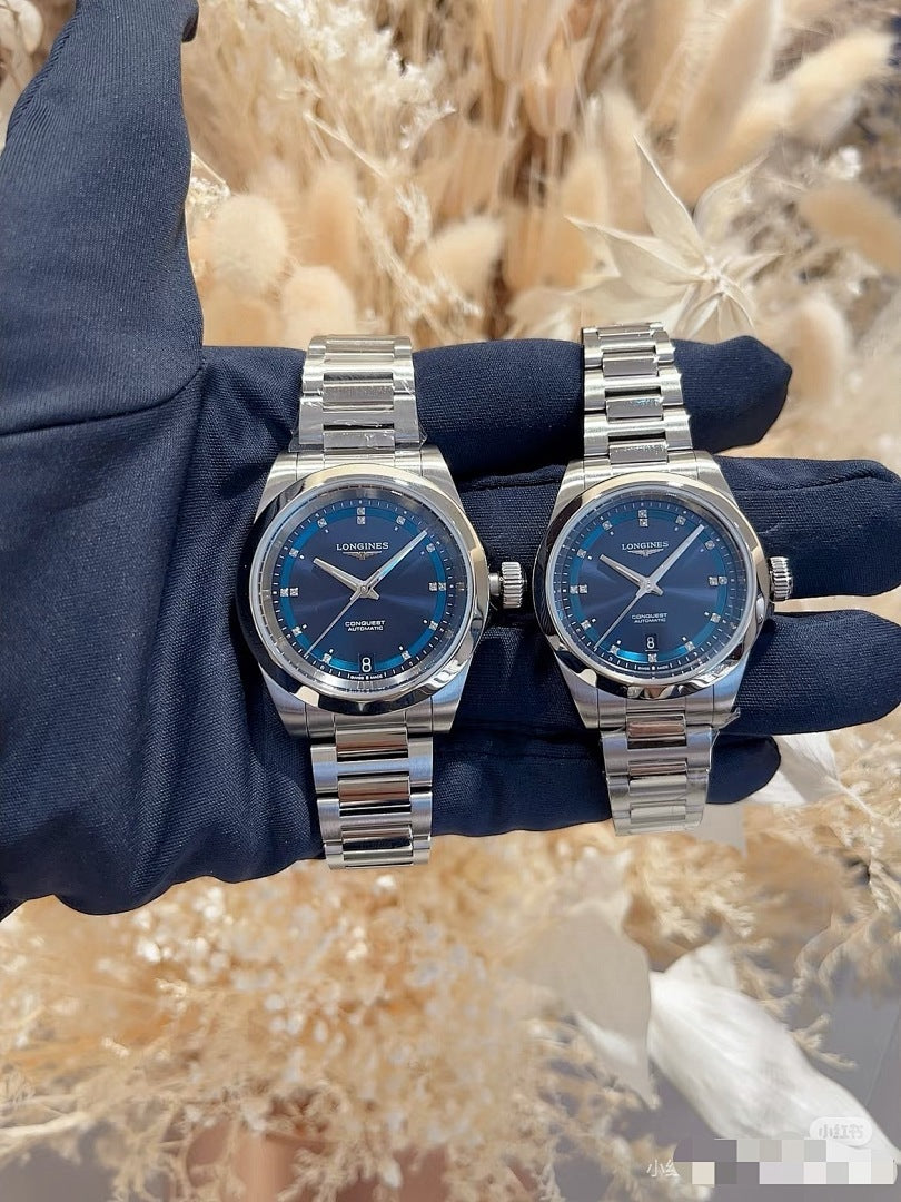 Longines watch, blue dial with stainless steel bracelet and round silver case