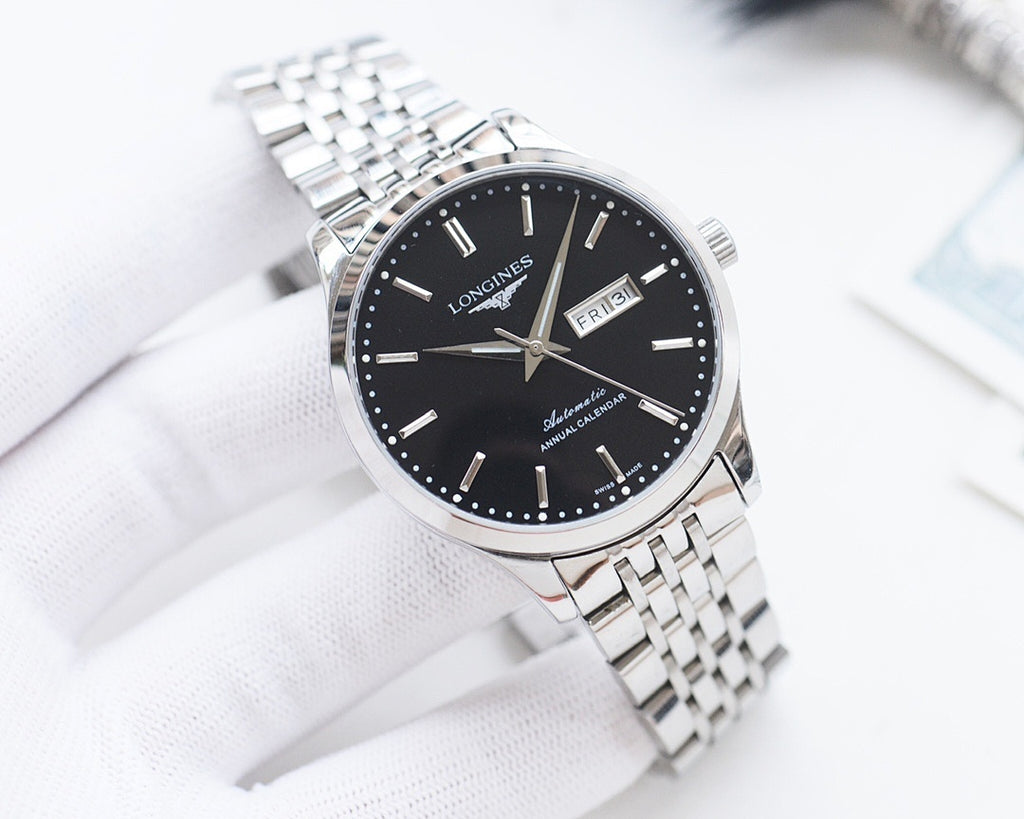 Longines watch with black dial, silver bezel, and stainless steel link bracelet