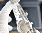 Longines watch side profile with metal bracelet links and gold-toned crown