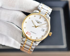 Longines watch with white dial, gold hands, and two-tone bracelet